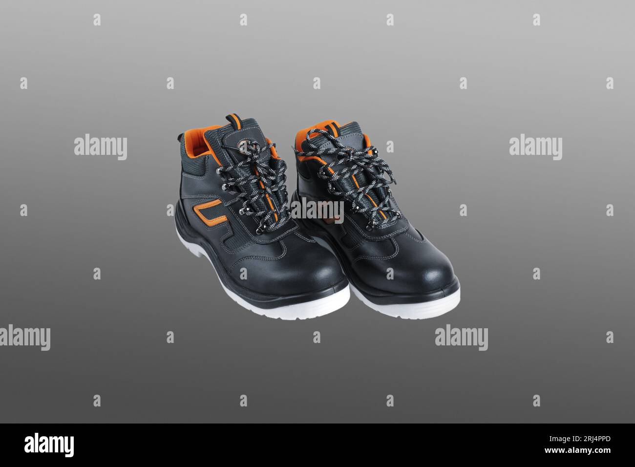 Protective safety shoes. Close-up. Isolated on a gray background. Stock Photo