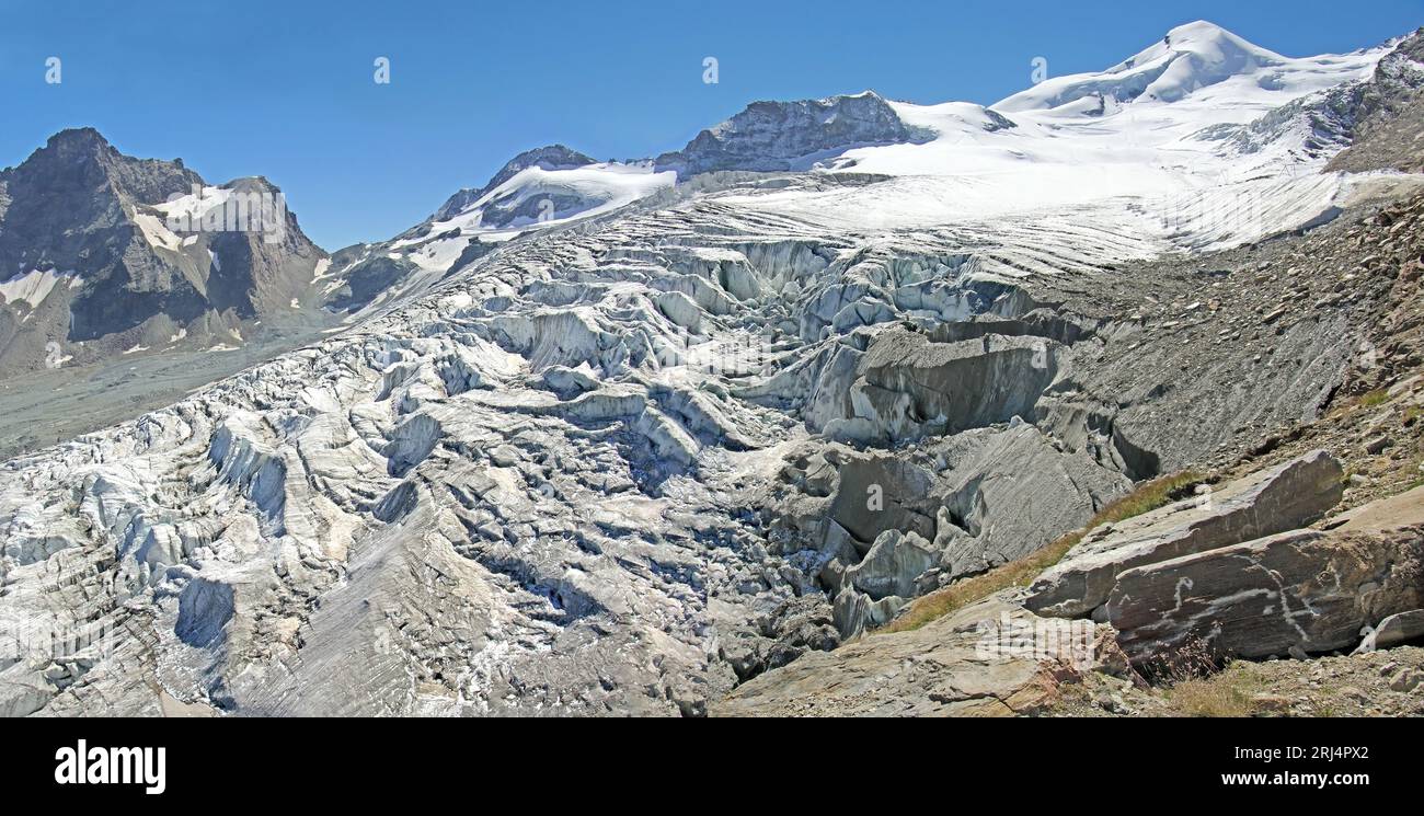 Fee glacier and Allalin seen from Spielboden above Saas Fee. Wallis Switzerland Panoramic format 2:1 Stock Photo