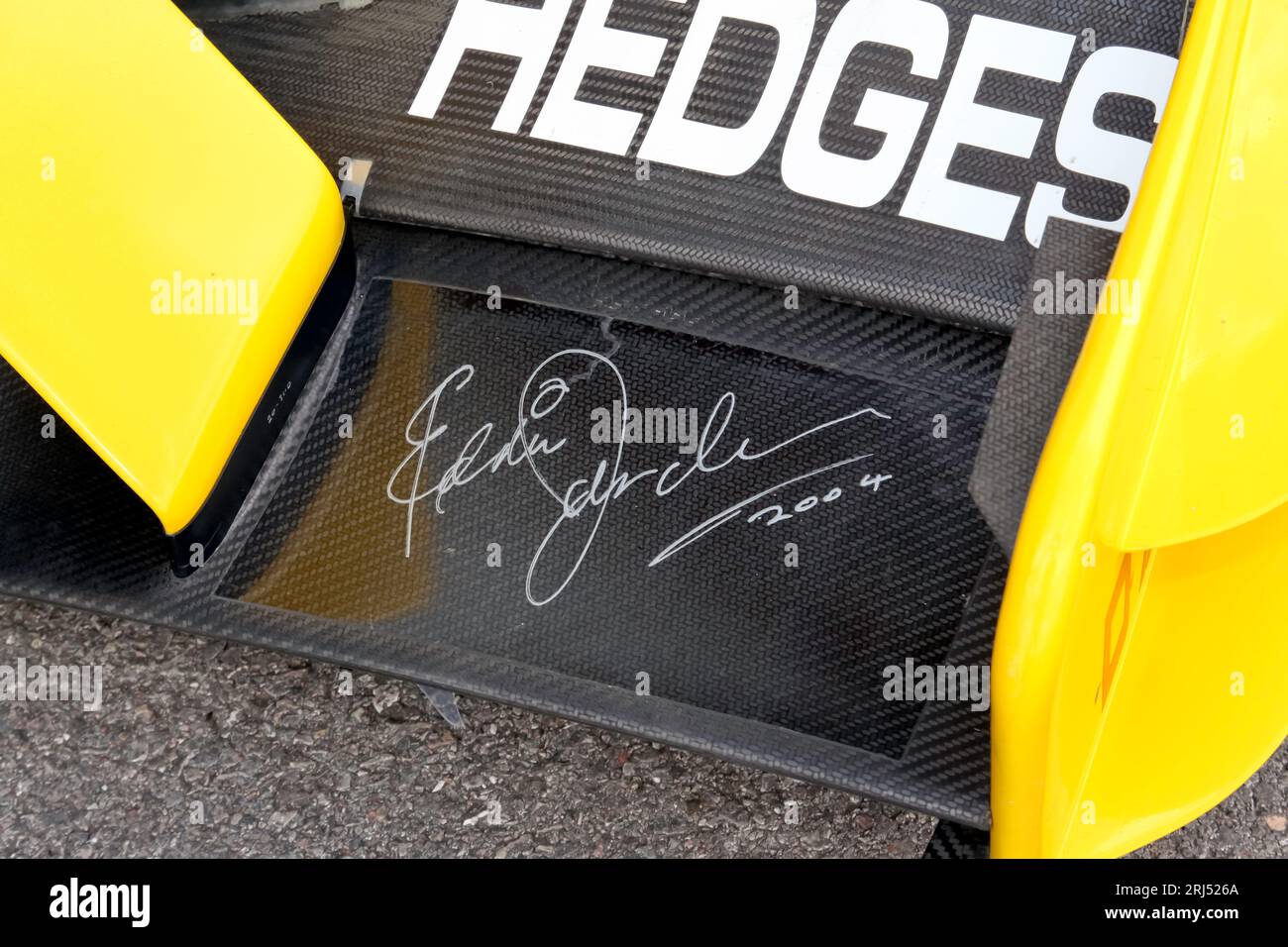 Eddie Jordan's Signature, on the front wing of Takuma Sato's,  DHL Jordan Honda,  EJ12, on display at the 2023 British Motor Show, Farnborough. Stock Photo