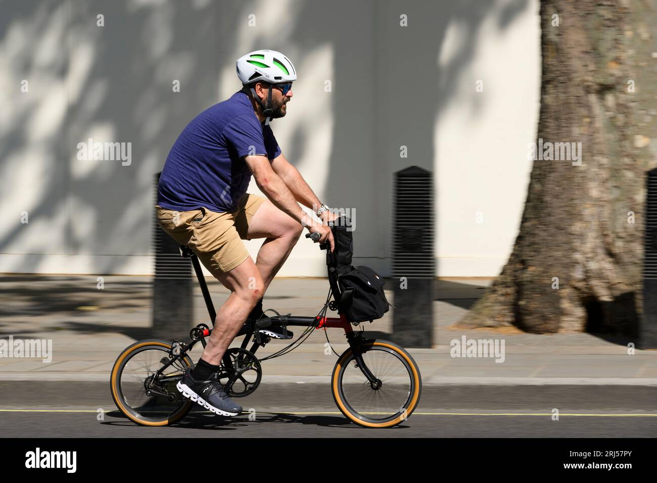 Man riding brompton bike hi-res stock photography and images - Alamy