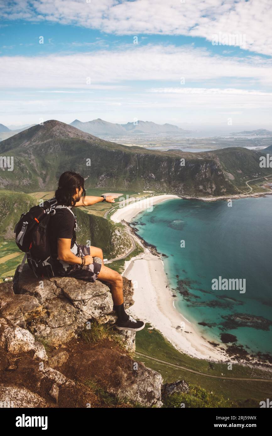 Man sitting beach mountains hi-res stock photography and images - Alamy