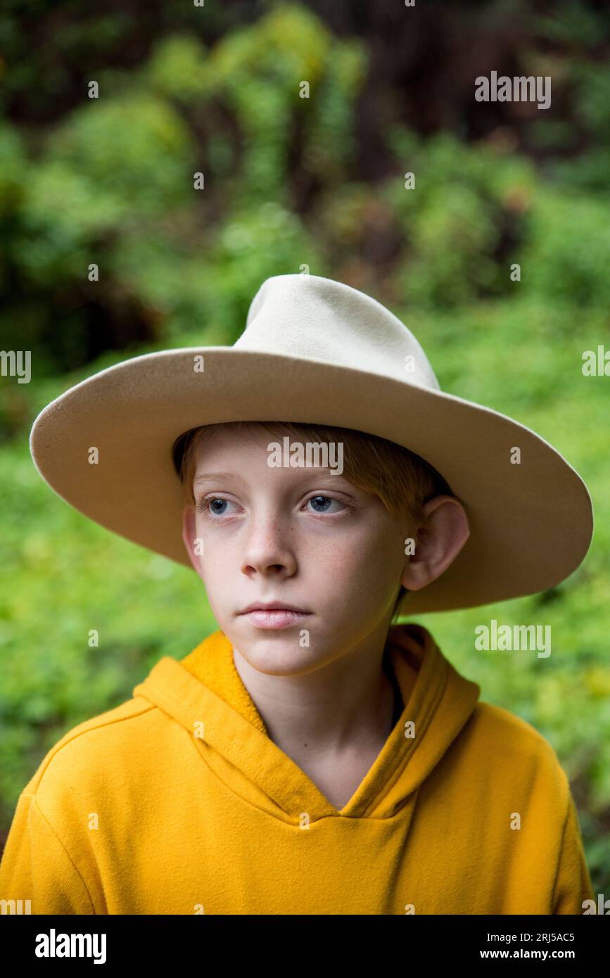 Young boy wearing large old hat Stock Photo
