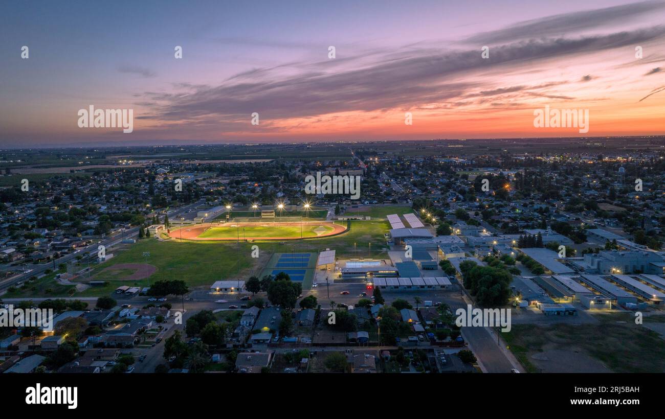 An aerial view of a small high school football stadium during the