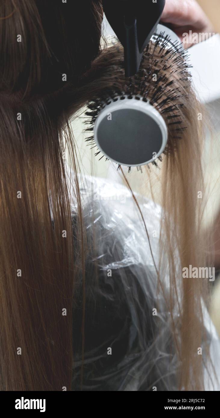 Drying hair hair dryer round hi-res stock photography and images - Alamy
