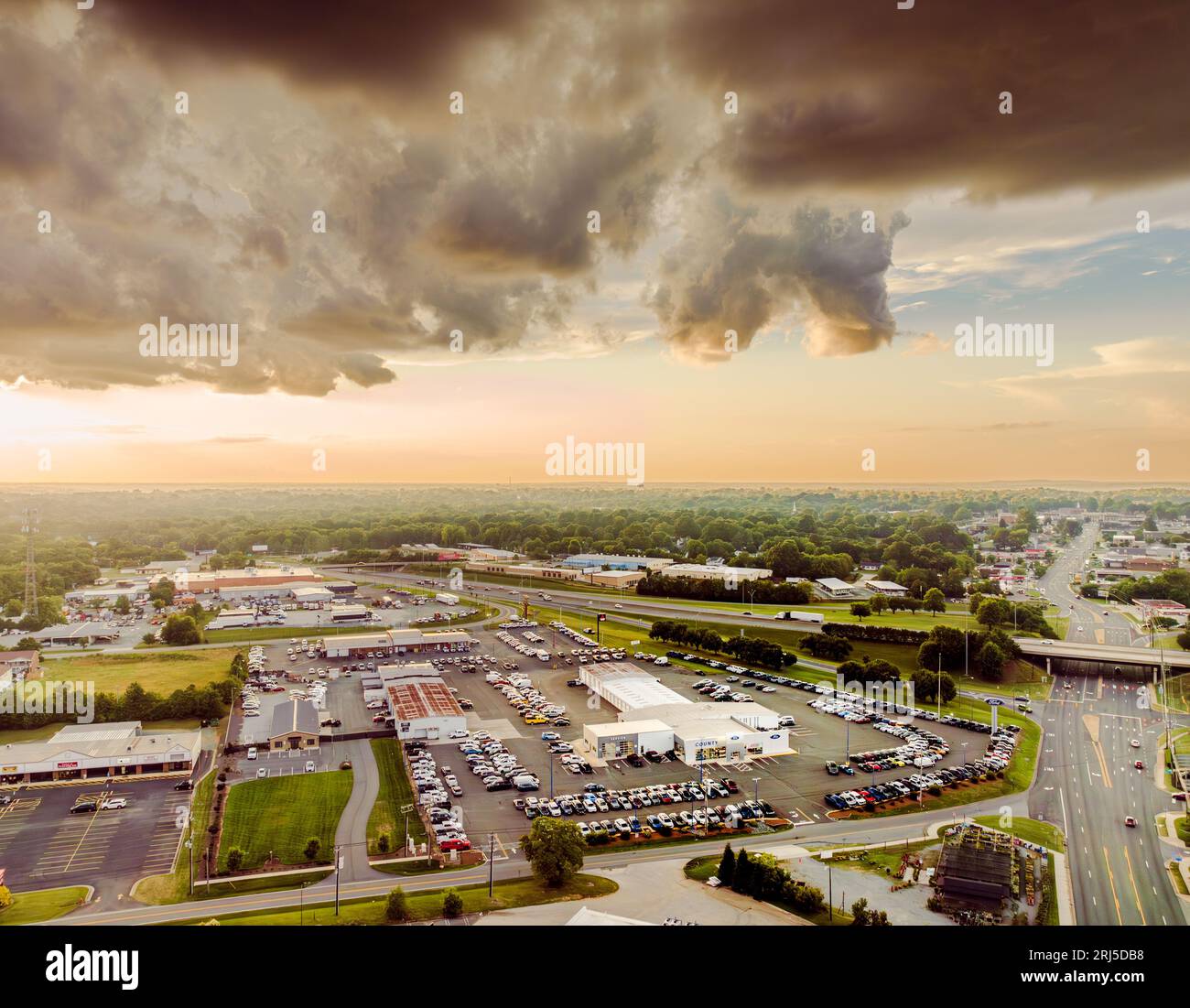 An aerial view of the Graham skyline with multiple cars parked in front ...