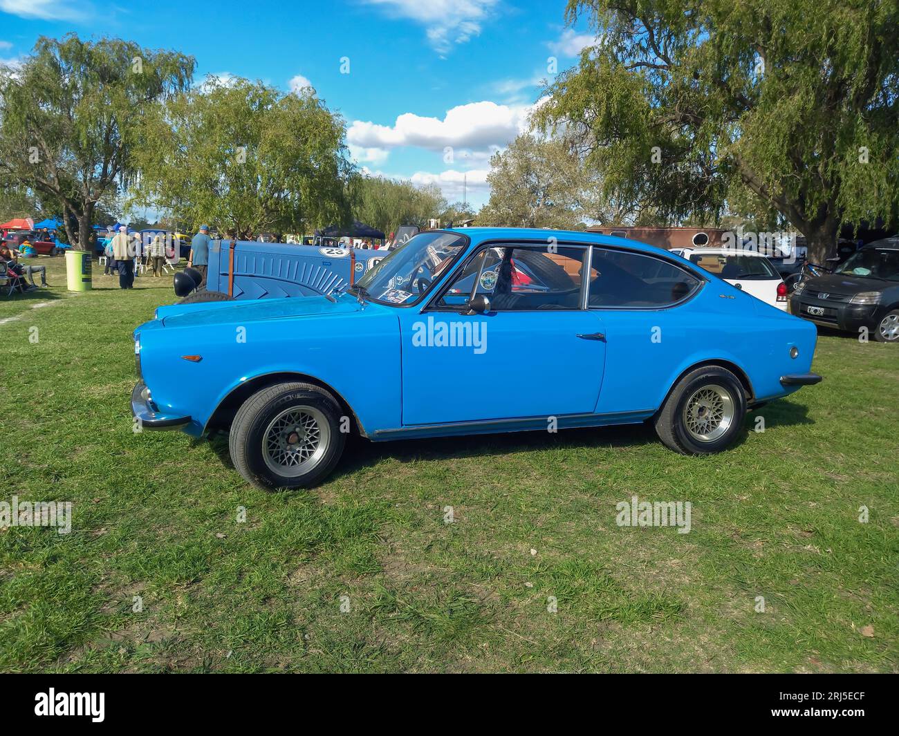 An old blue 1972 Fiat 125 Sport coupe fastback Berlinetta on lawn Stock Photo
