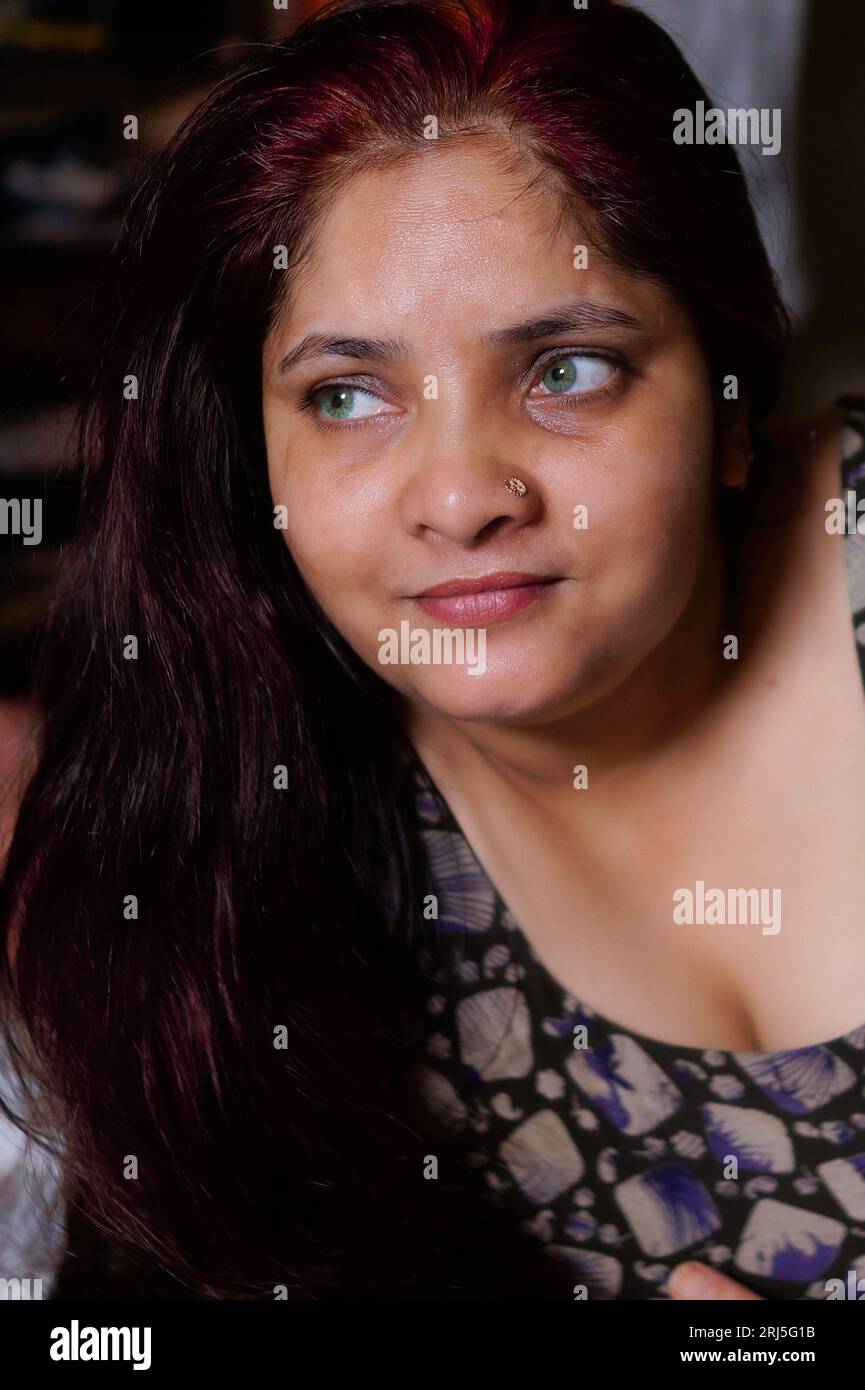 A gorgeous South Asian adult female with captivating emerald green eyes  Stock Photo - Alamy