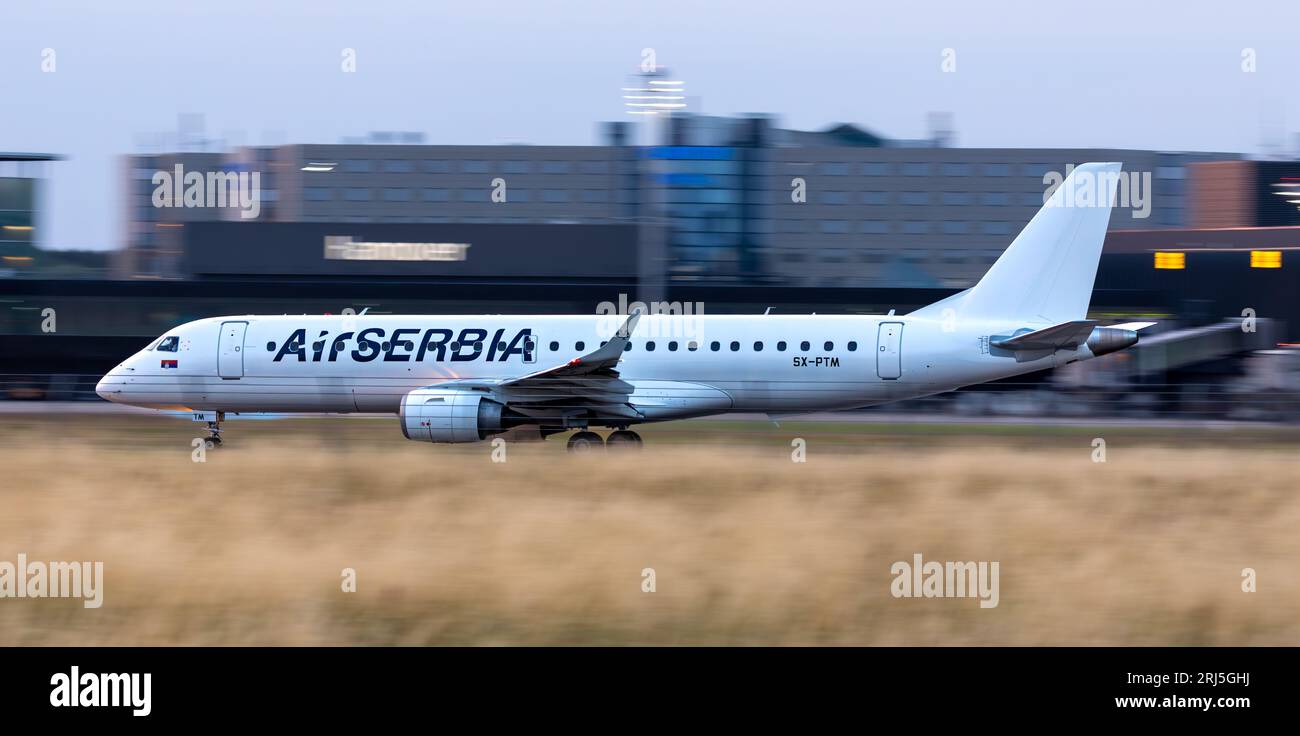 The Air Serbia Embraer E190SR take off at Hannover airport (HAJ) in ...