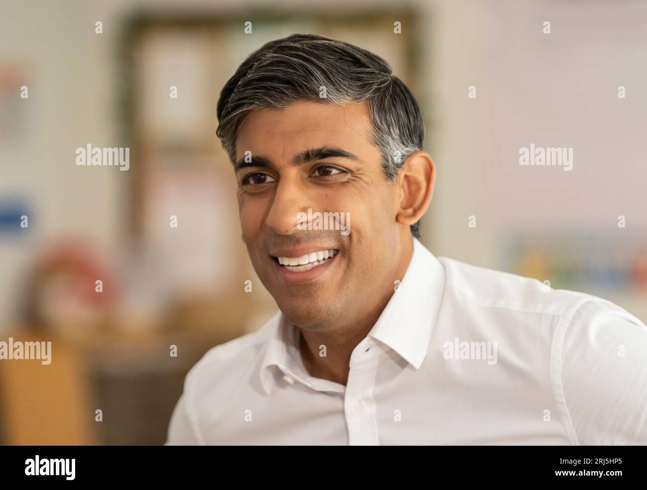Prime minister rishi sunak during a visit to the busy bees nursery in