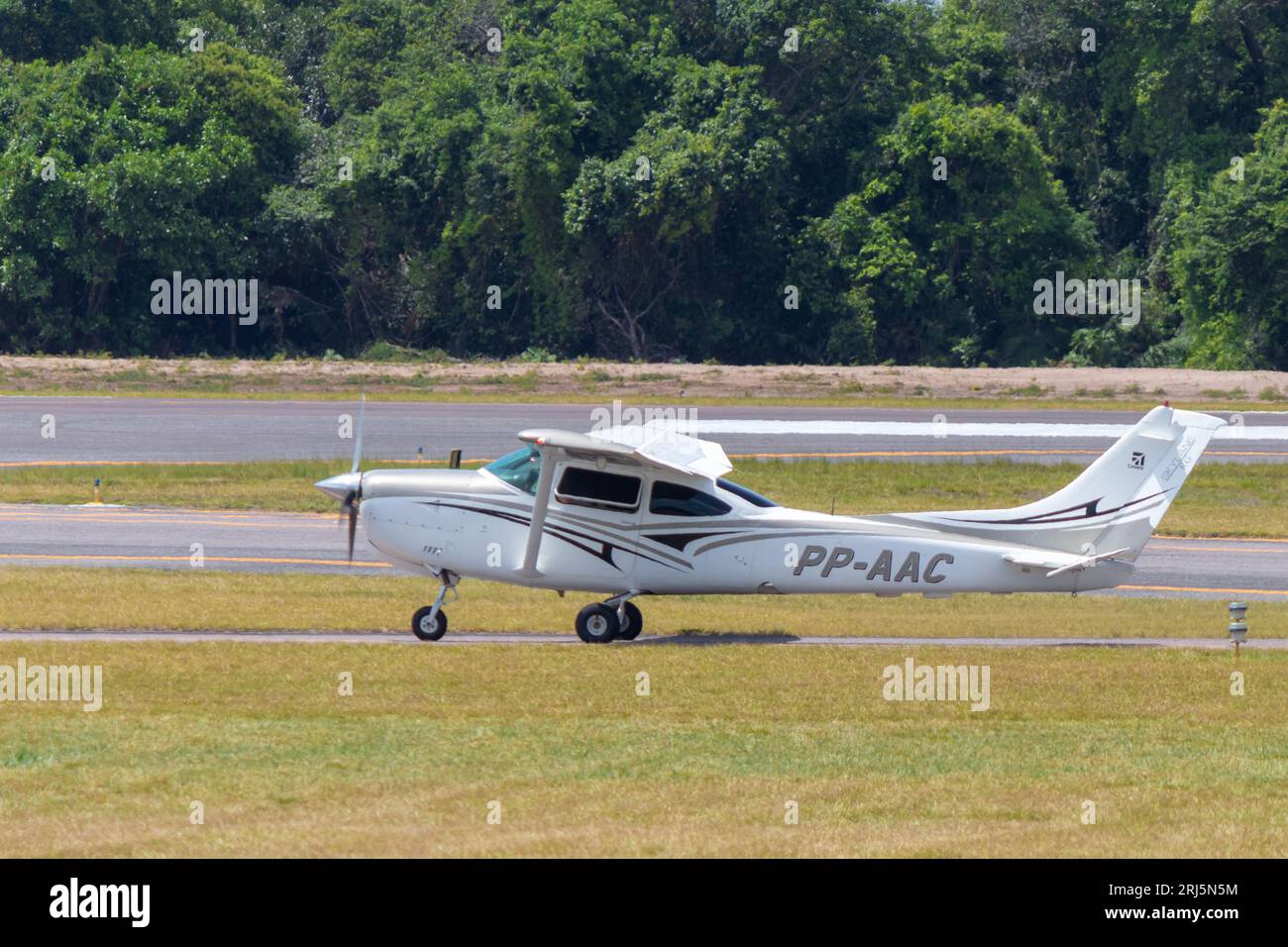 Private single-engine Cessna R182 Skylane RG (PP-AAC) taxi after landing at Santarem Airport (SBSN). Stock Photo