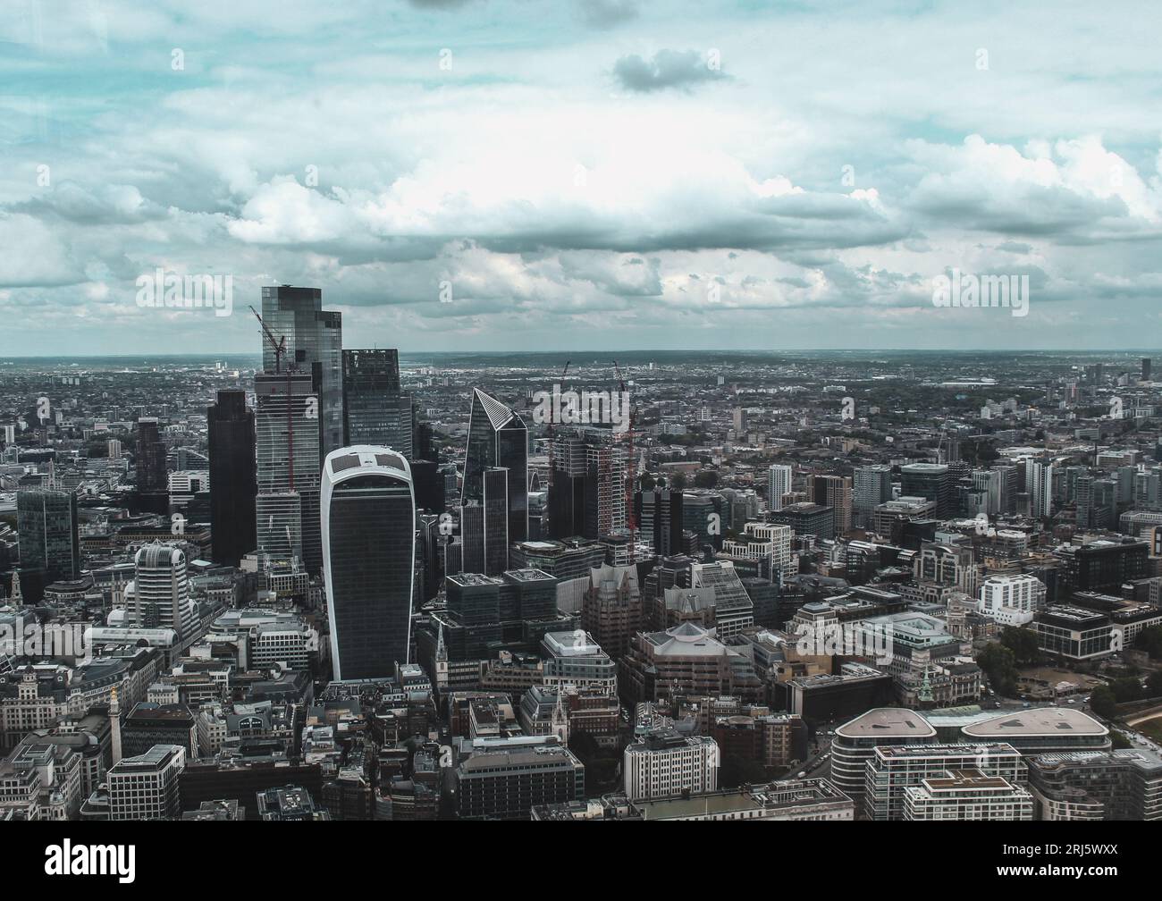 Aerial cityscape photo of London, UK, taken in overcast and moody weather conditions. Stock Photo