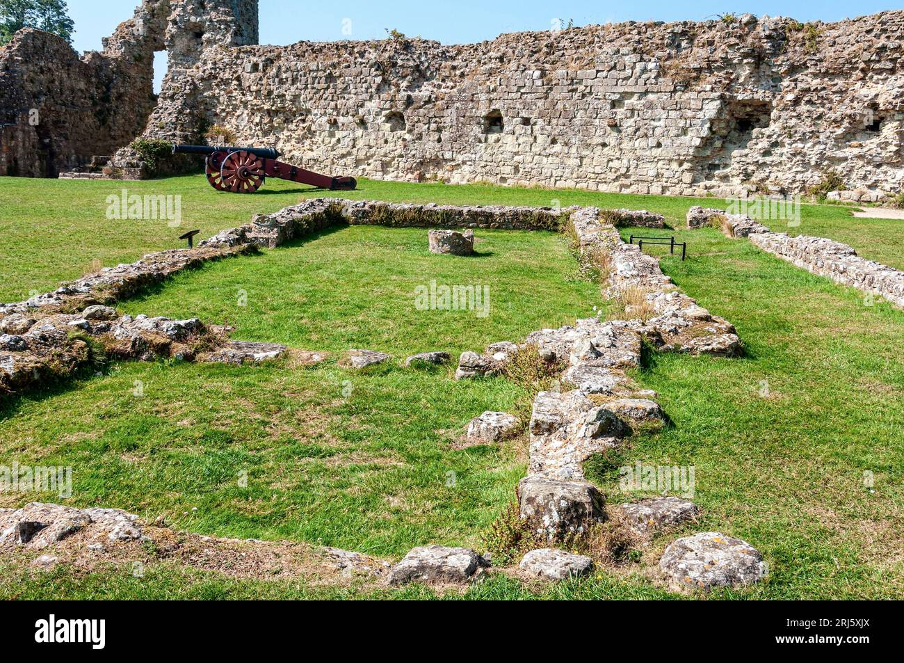 The stone foundations of the chapel at Pevensey Castle outline the