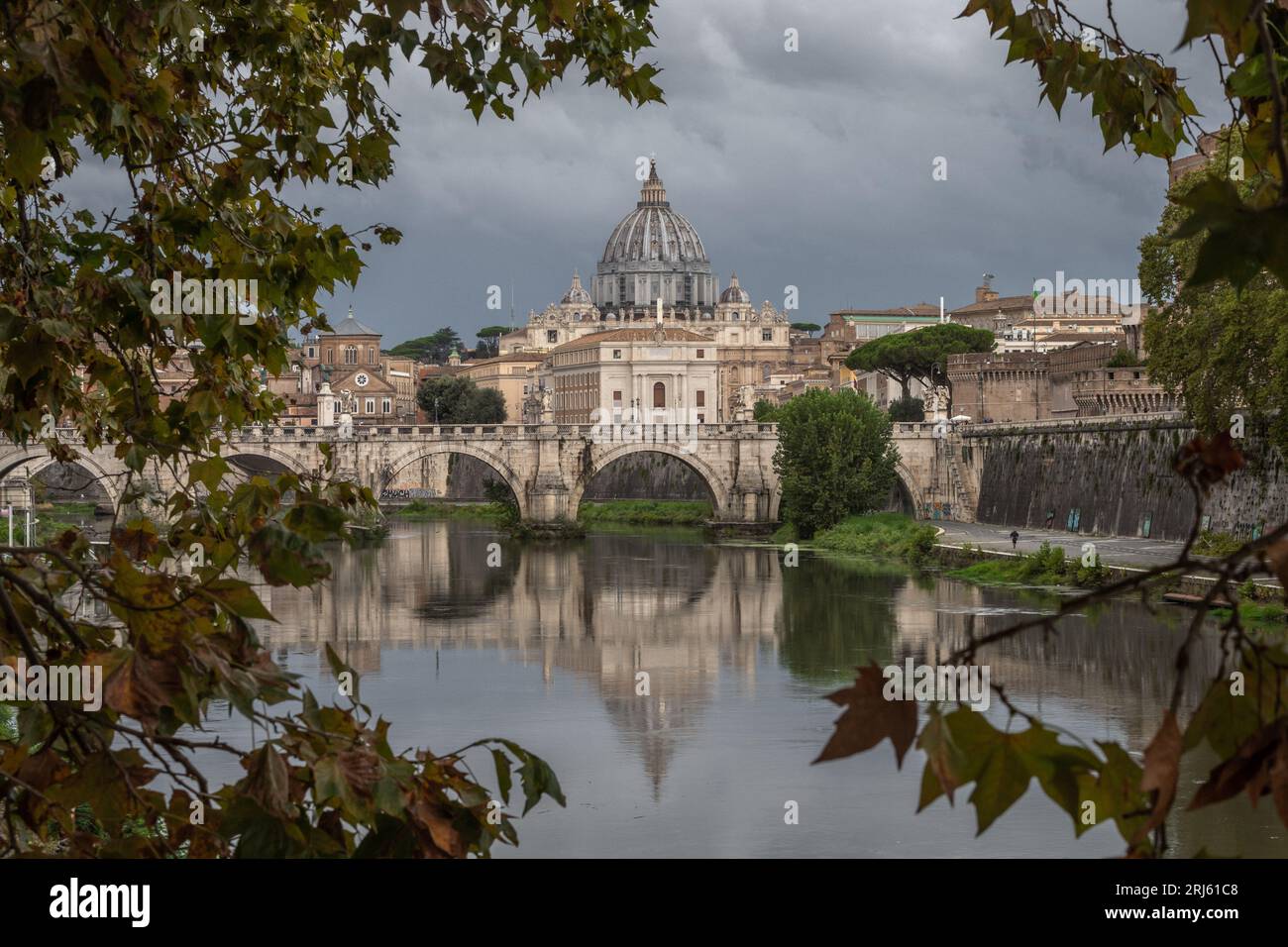 An historic bridge spanning a serene river near Vatican City Stock Photo