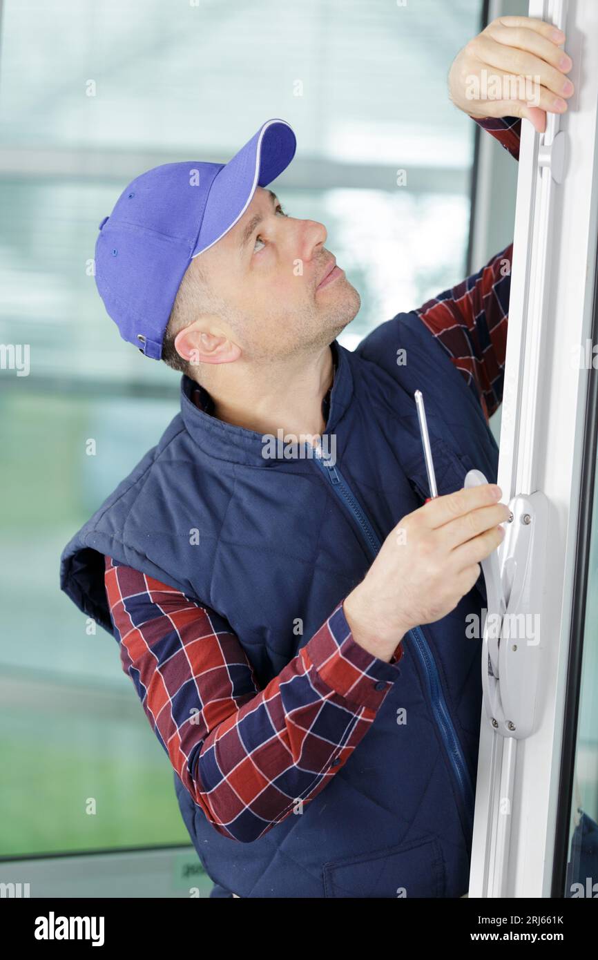 worker with different pvc window Stock Photo
