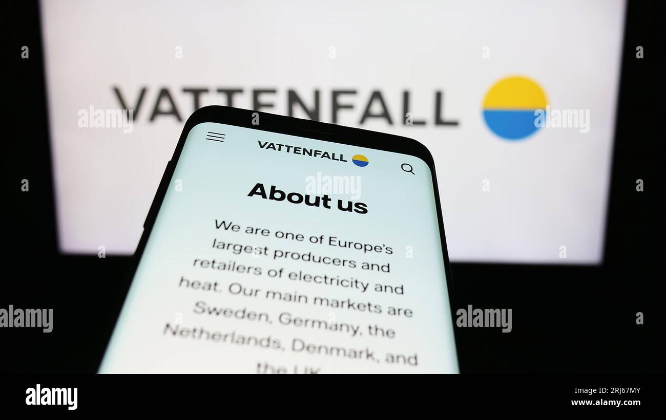 Smartphone with website of Swedish energy company Vattenfall AB on screen in front of business logo. Focus on top-left of phone display. Stock Photo
