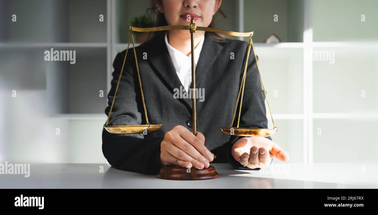 Portrait of a judge hold judges gavel and old scales concept of justice