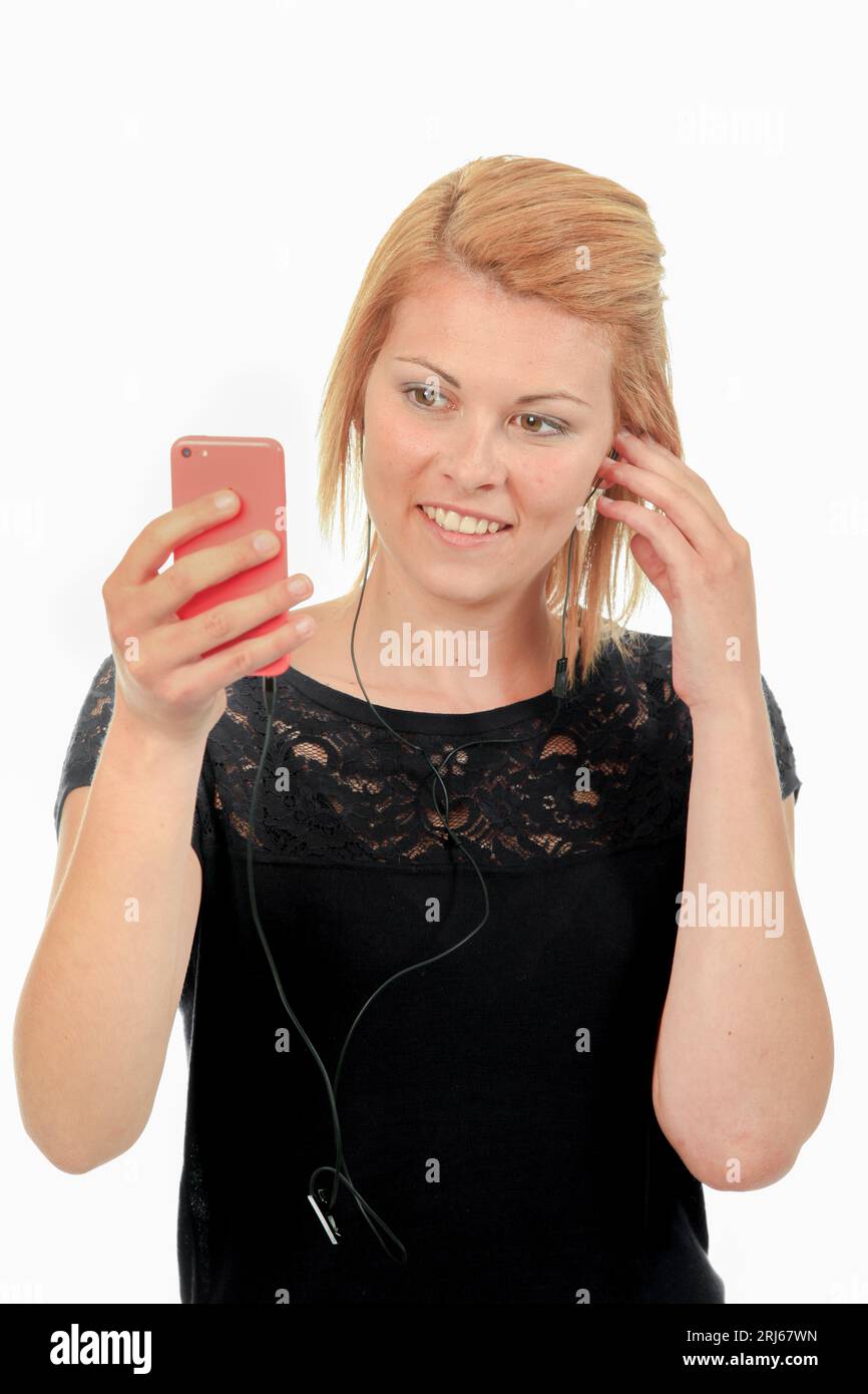 woman is listening to her phone music Stock Photo