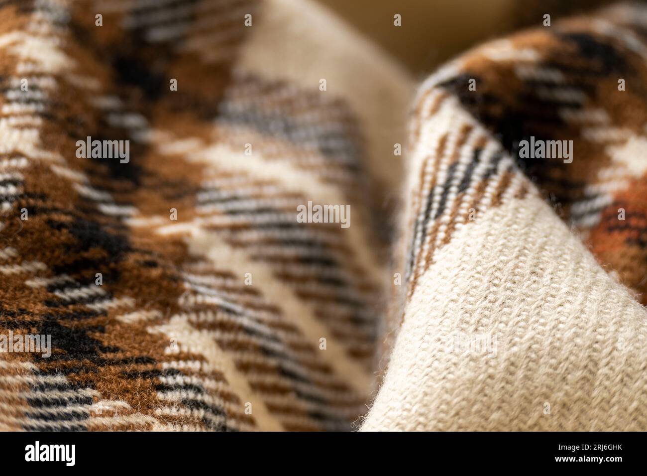 Soft checkered woolen cloth, fashion industry, cozy blanket in warm tones Stock Photo