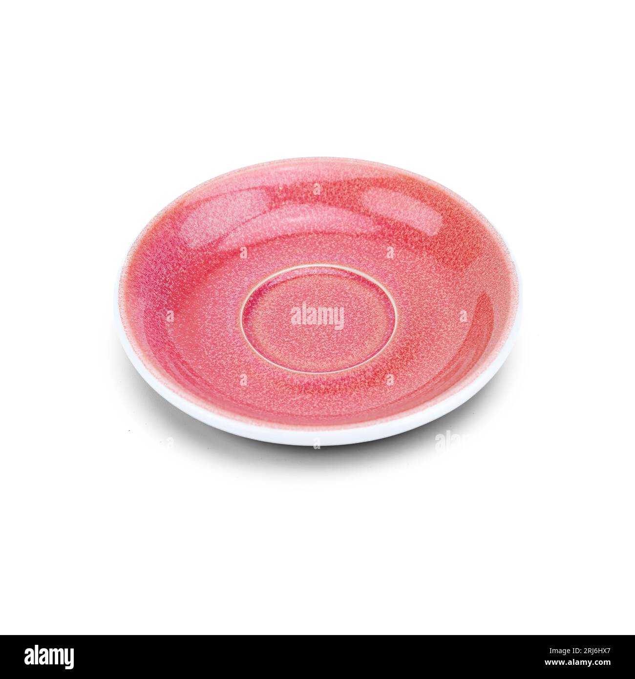A closeup of a pink ceramic plate on a white background Stock Photo