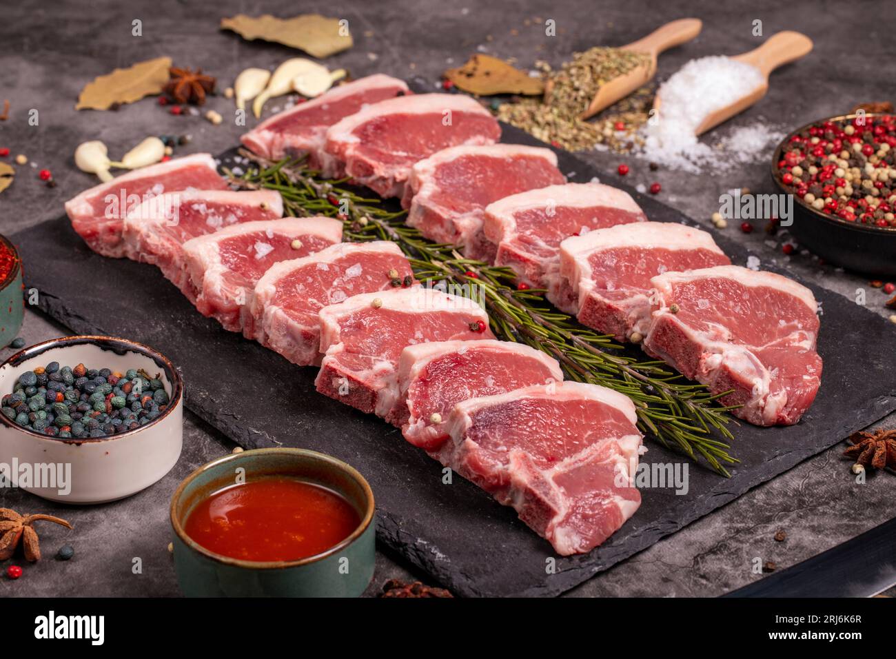 Fresh lamb back fillet. Raw lamb fillet on dark background. Butcher