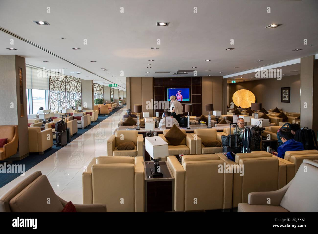 UK, England, London Heathrow Airport, Emirates Business Class passengers relaxing in Lounge Stock Photo