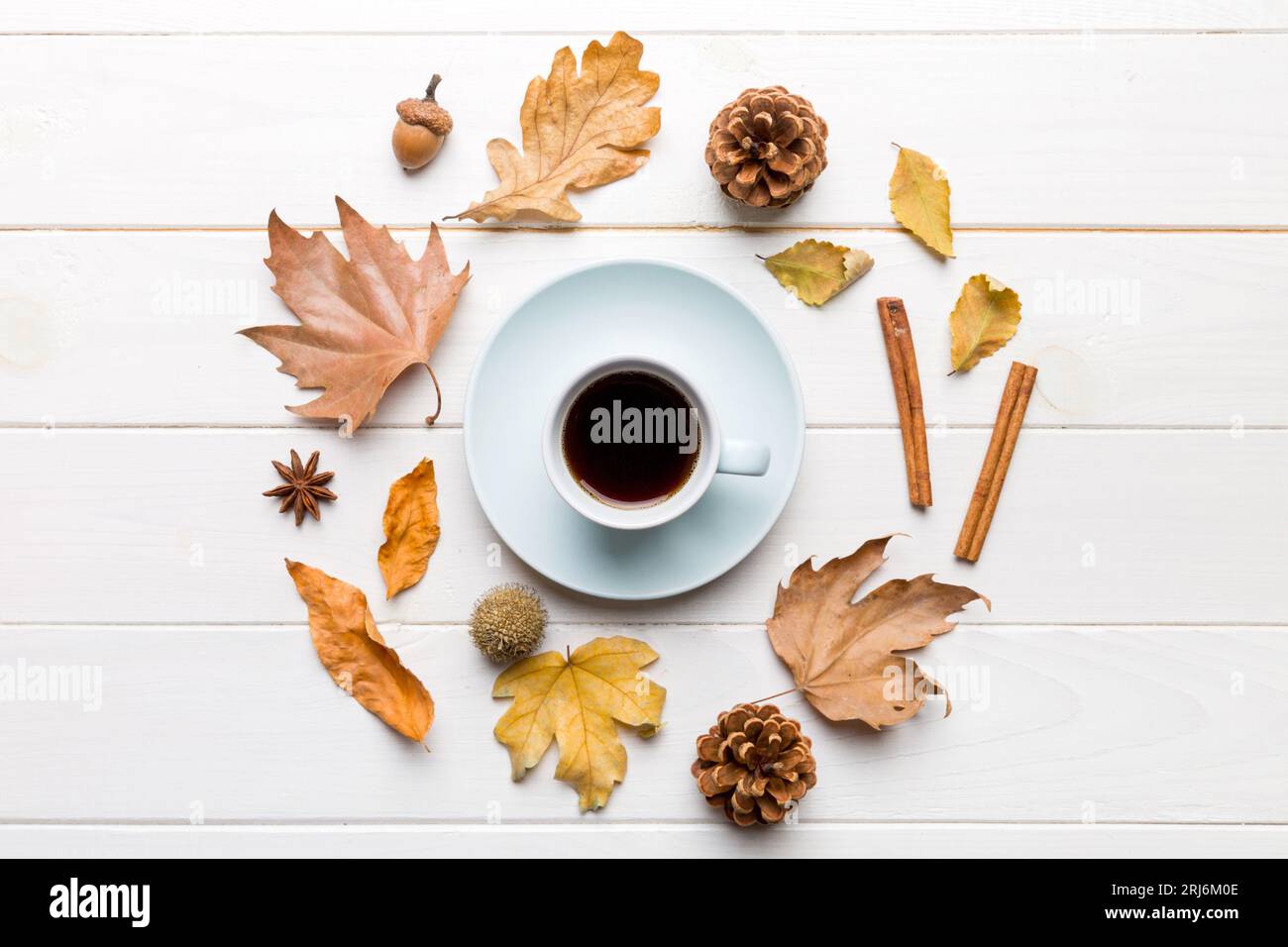 Flat lay composition with colorful Autumn cup of coffee and leaves on a ...
