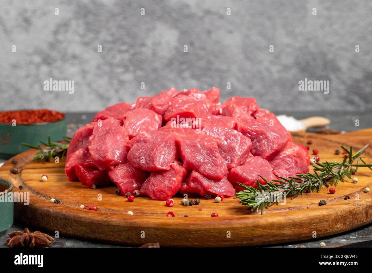 Beef cubed. Fresh raw beef diced meat on dark background. Butcher ...