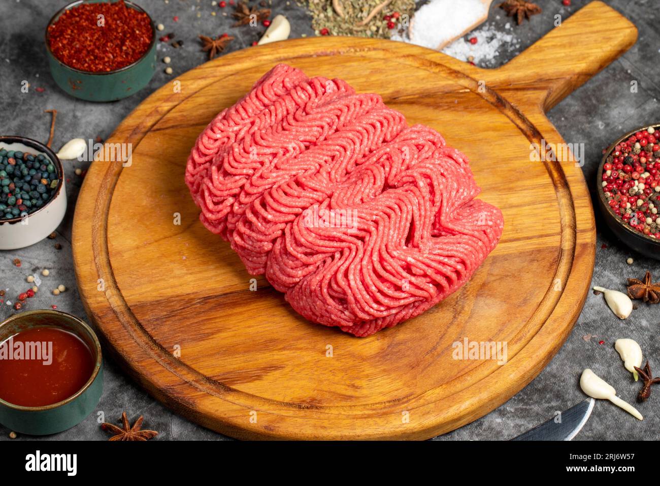 Ground beef. Fresh raw beef minced meat on dark background. Butcher products Stock Photo
