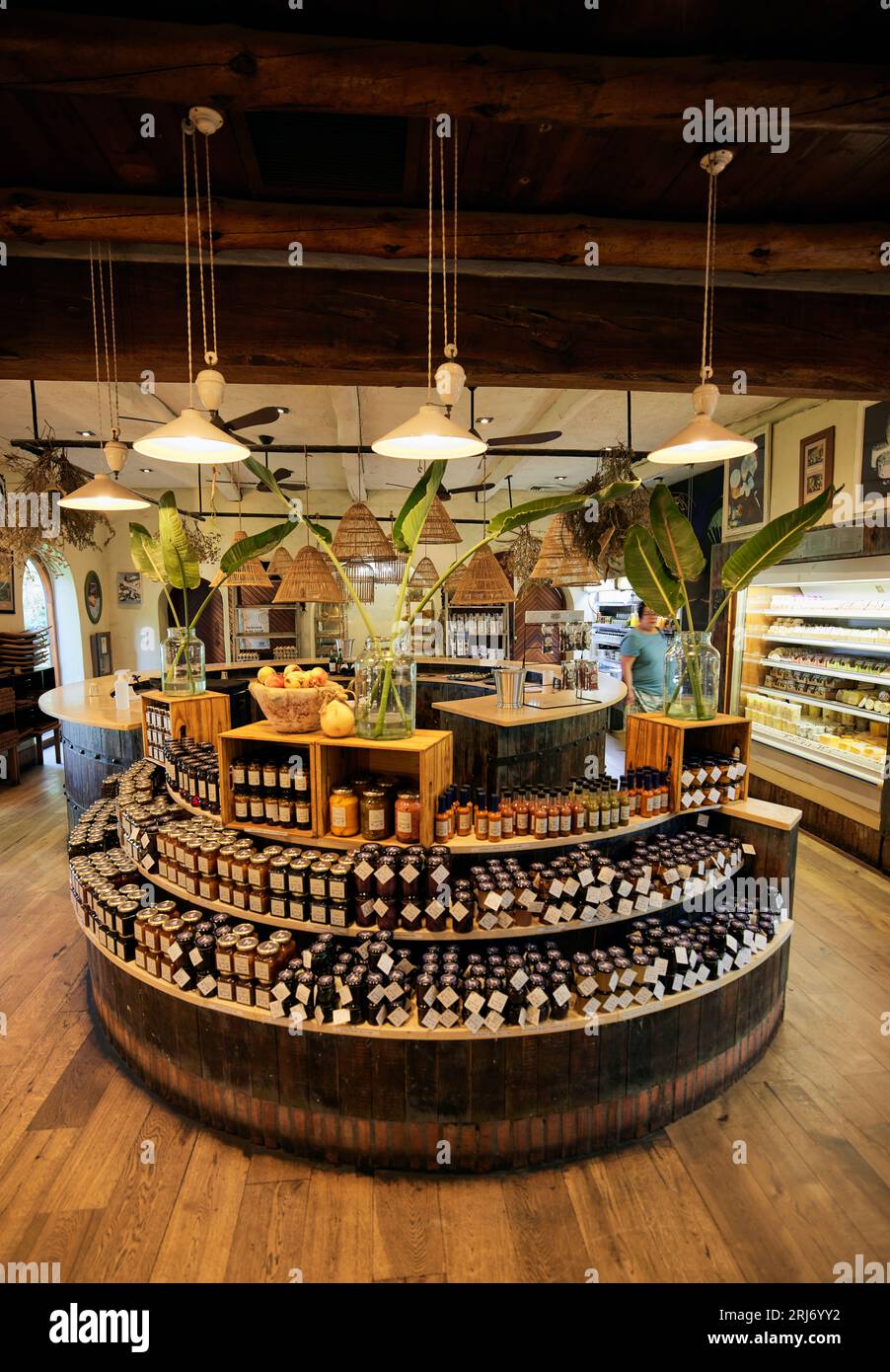 A close-up image of a store shelf featuring a range of glass jars containing assorted products Stock Photo
