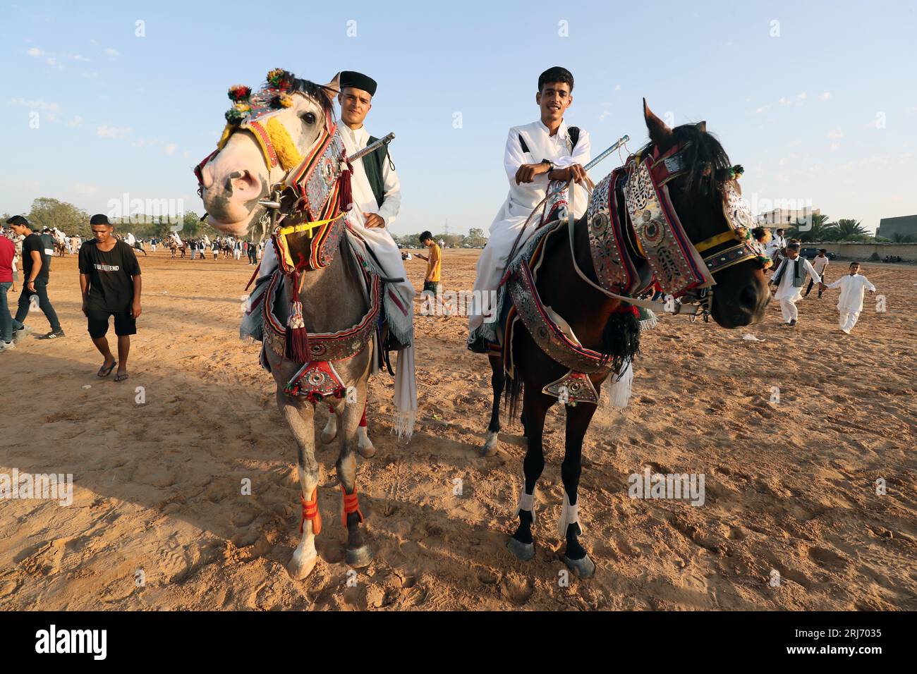 Tajura, Libya. 20th Aug, 2023. Two men dressed in traditional Libyan