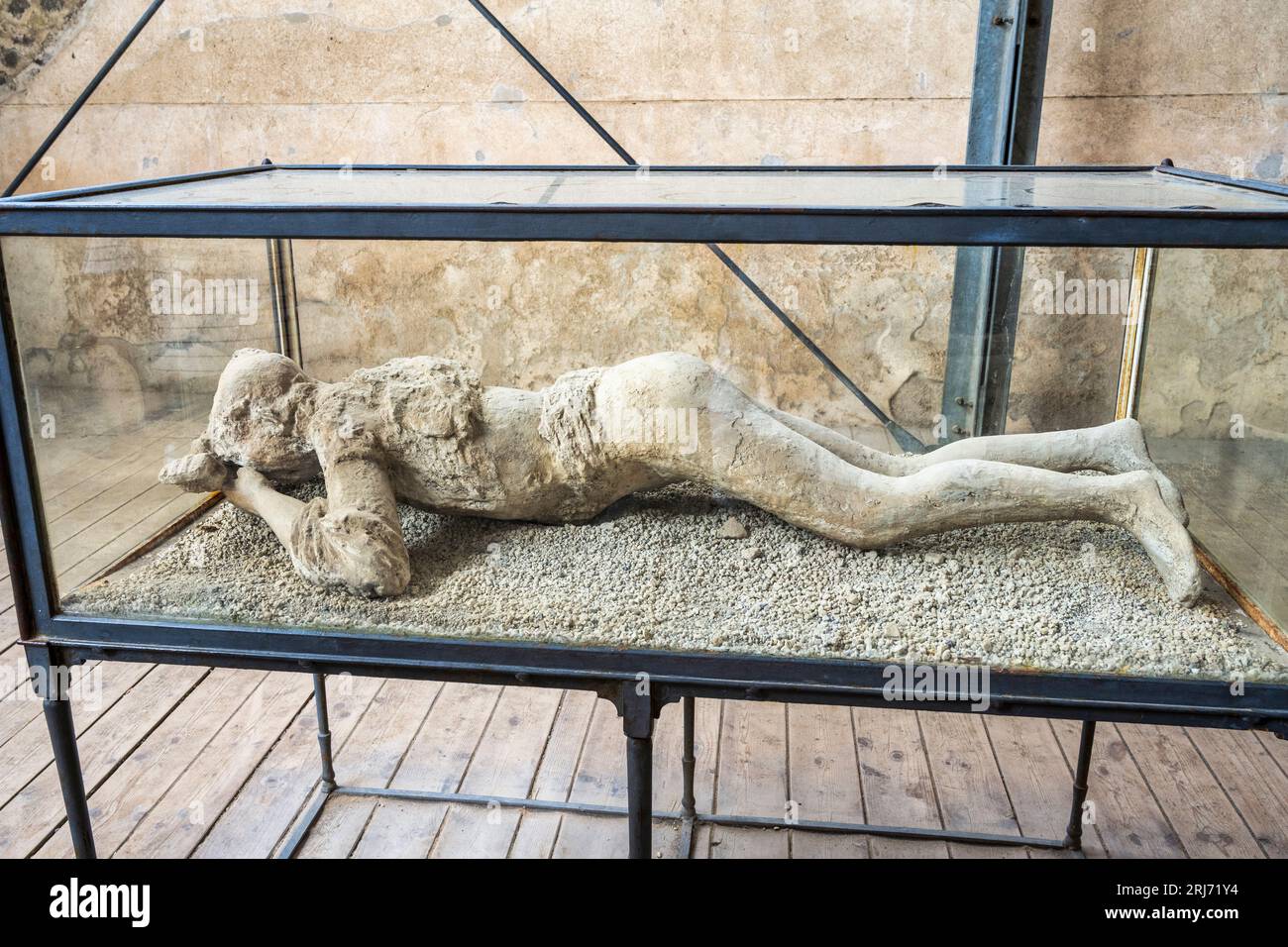 Plaster cast of a victim of the eruption in Stabian Baths in the ruins of the ancient city of Pompeii in the Campania Region of Southern Italy Stock Photo