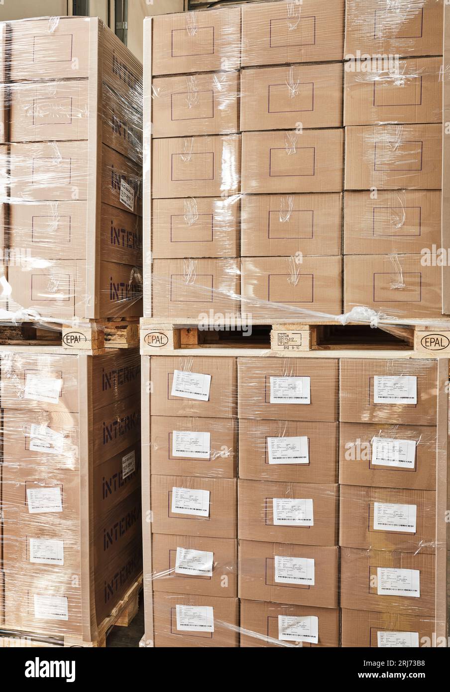 wooden pallets stacked upon each other in a warehouse. factor