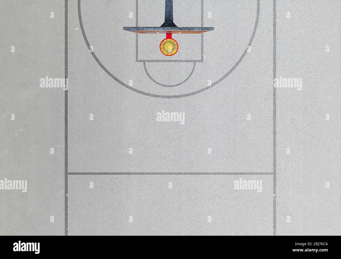A photo of a minimal basketball field seen from the above. Stock Photo