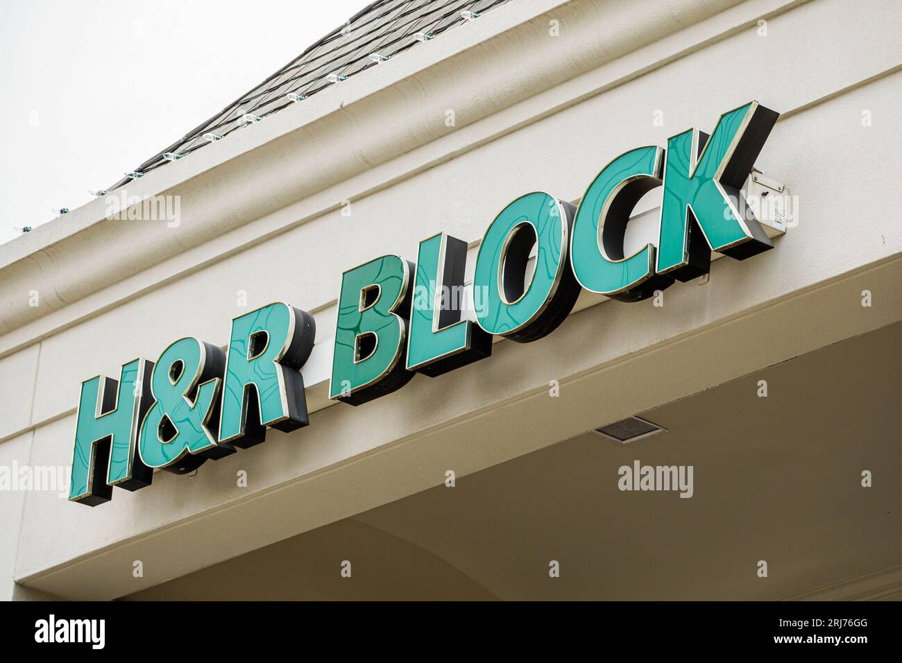 Charlotte North Carolina,H&R H & R Block tax services sign,outside exterior,building front entrance,business shop merchant market marketplace,selling Stock Photo