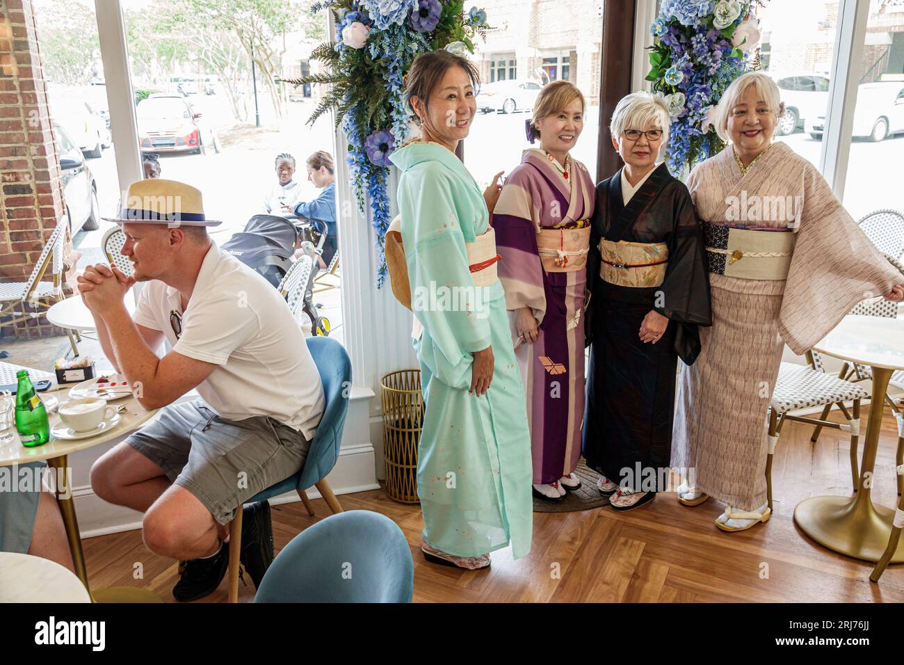 Charlotte North Carolina,Chez Marie Patisserie bakery,Japanese American friends,wearing kimono traditional dress garment,Asian ethnic ethnicity,immigr Stock Photo