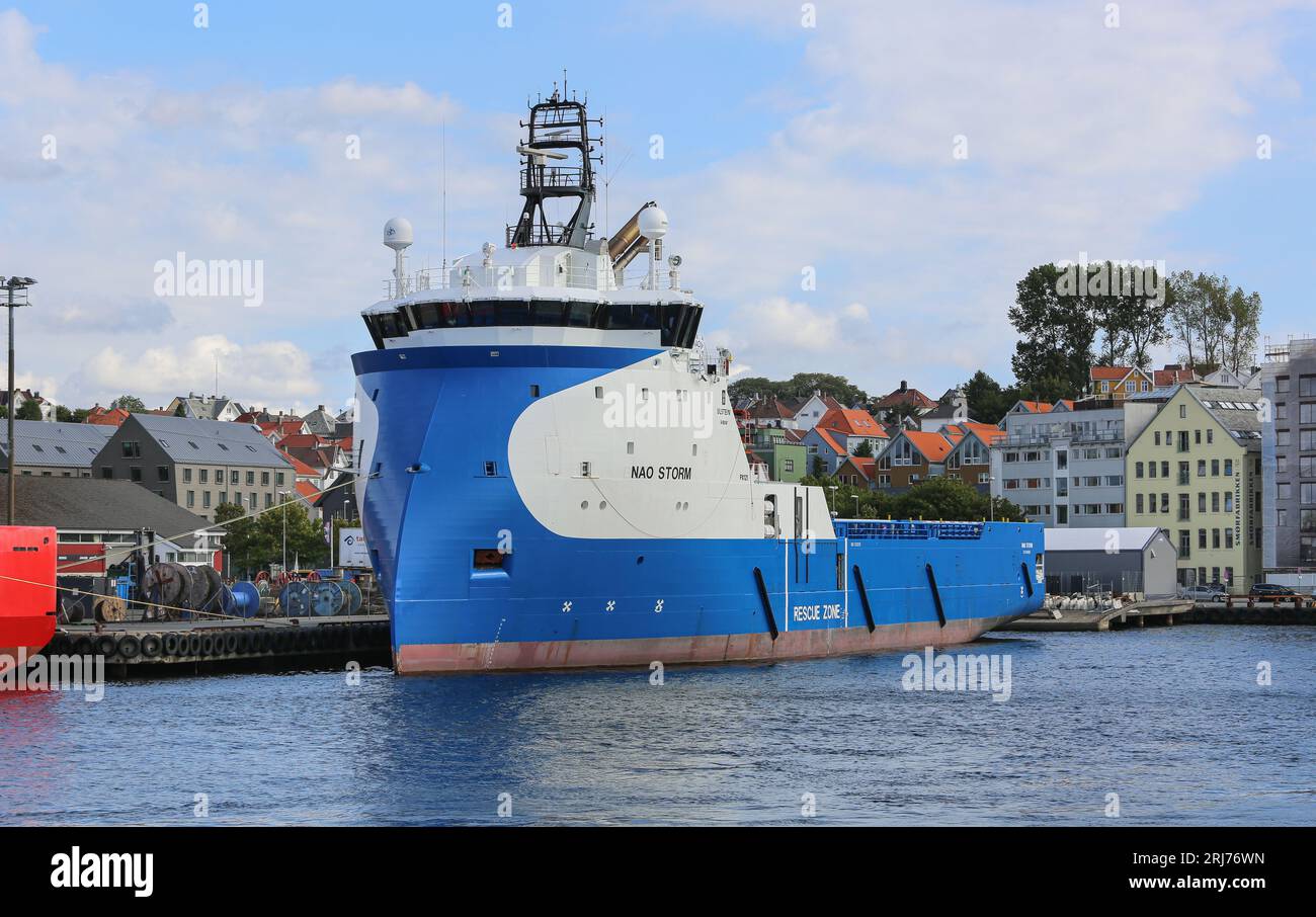Offshore platform supply vessel Nao Storm (also known as Blue, Aurora, Hermit Storm), Ulstein inverted X-bow hull design tug in Stavanger, Norway Stock Photo