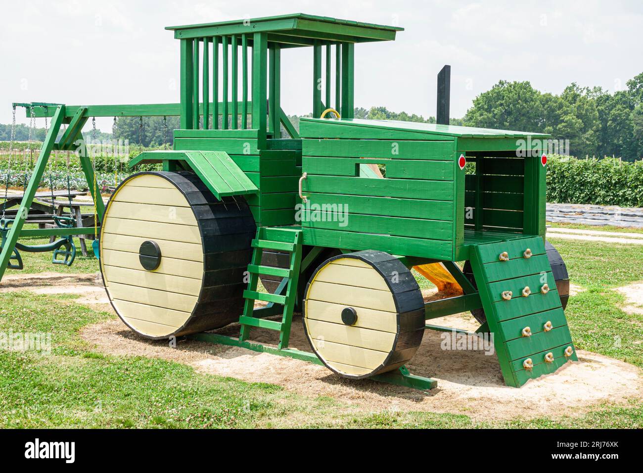 Playground giant green tractor hires stock photography and images Alamy