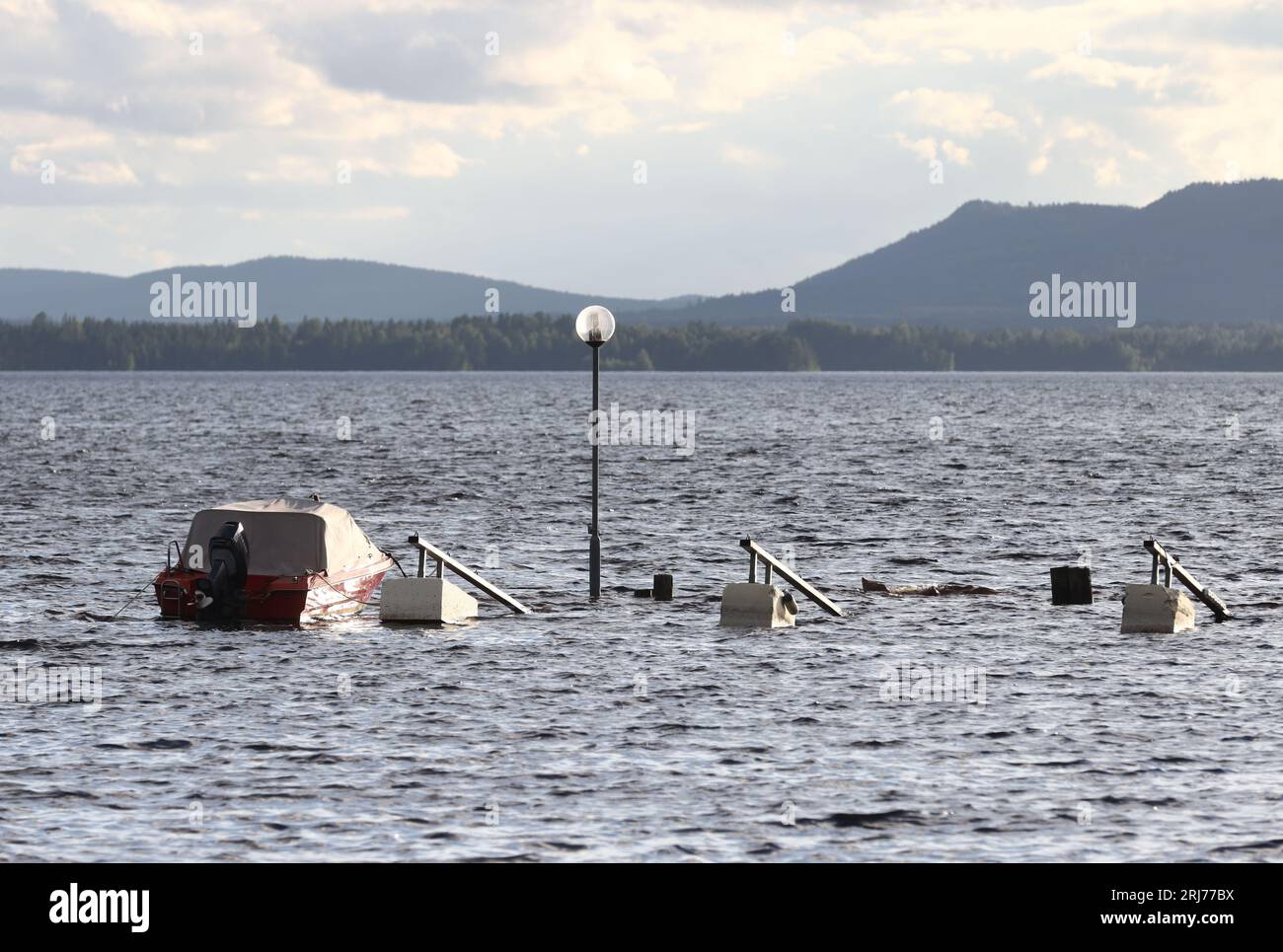 Flooded jetty and areas around lake Siljan, Nusnäs, Sweden, during Monday evening, the days after rainy weather Hans. Stock Photo