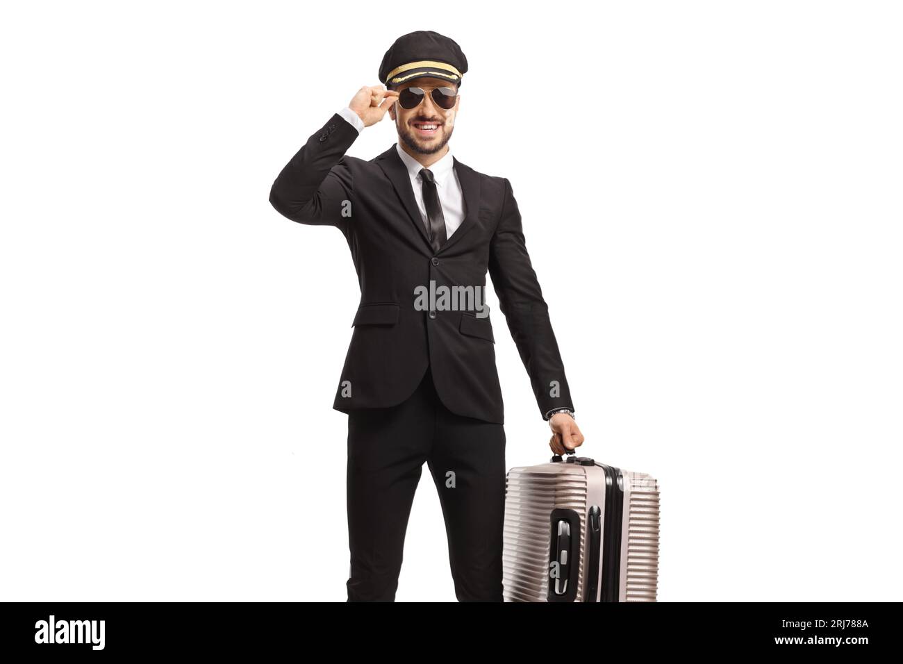 Pilot in a uniform and sunglasses carrying a suitcase isolated on white ...