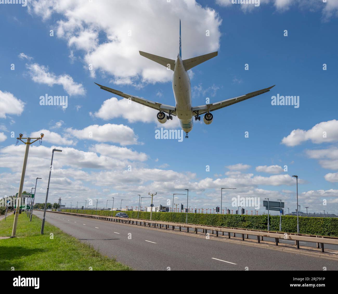 Civilian aircraft on landing approach to Heathrow Airport in London, UK, on 21 August 2023 above the A30 road Stock Photo