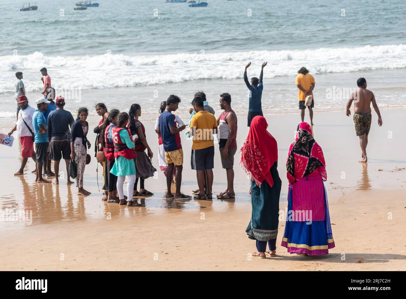 Calangute, Goa, India January 2023 Two women in colorful clothes