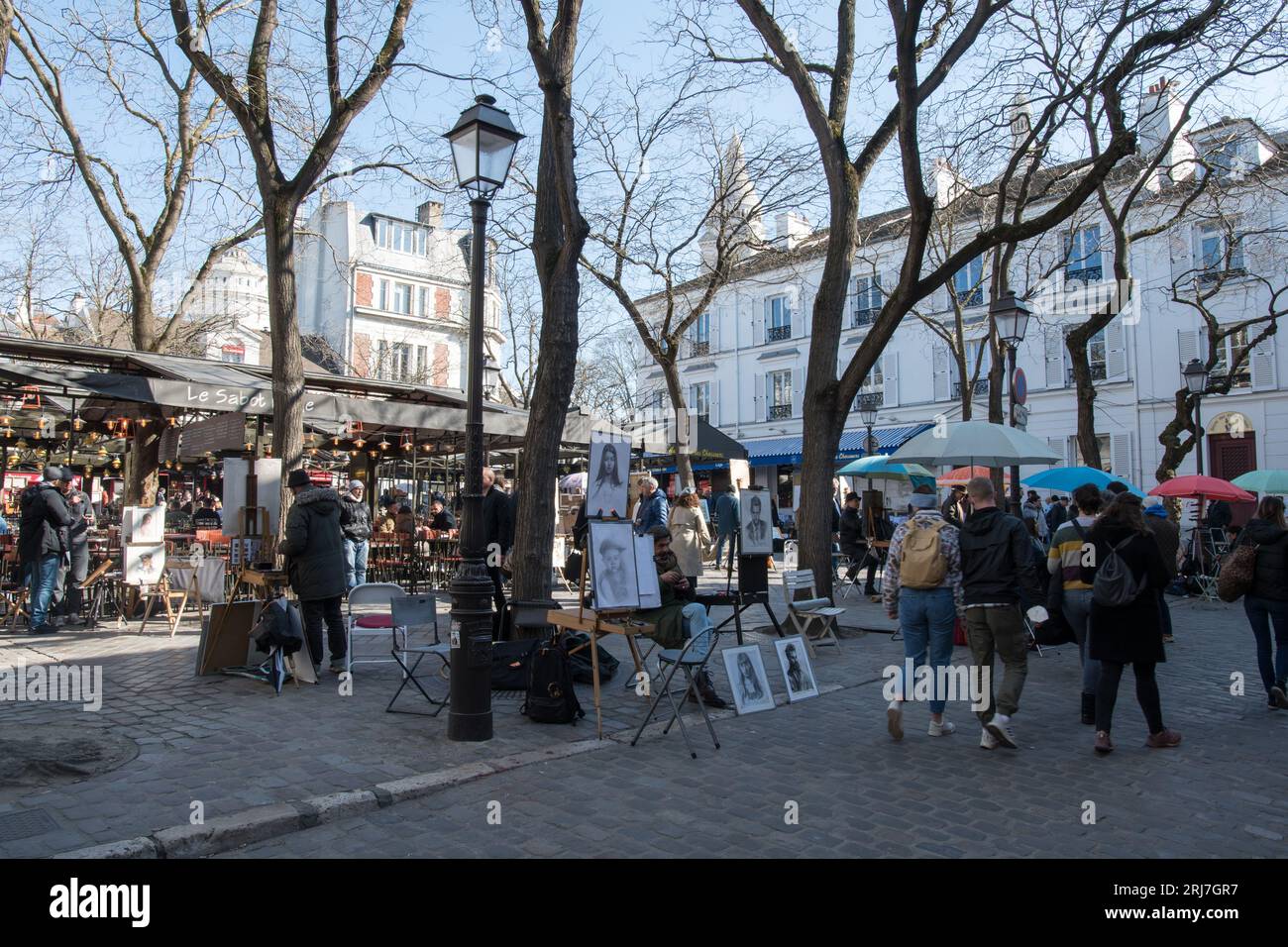 People and artists at iconic Place du Tertre in Montmartre Stock Photo