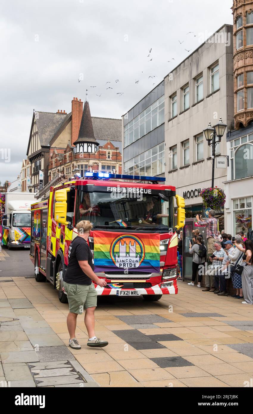 Lincolnshire Fire Brigade Engine in Lincoln Pride Parade, High Street, Lincoln City, Lincolnshire, England, UK Stock Photo