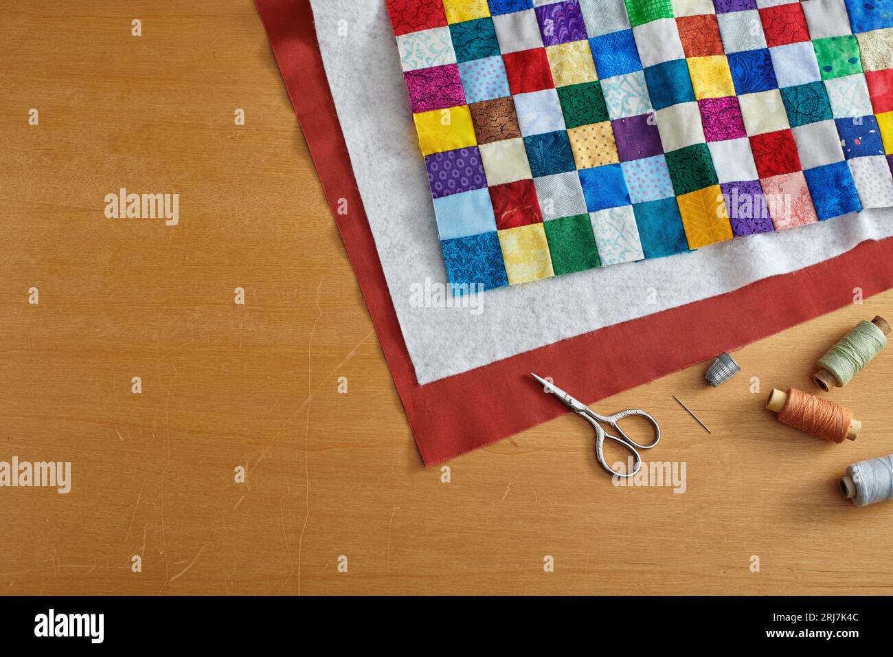 Process of quilt sandwich assembling, sewing accessories Stock Photo