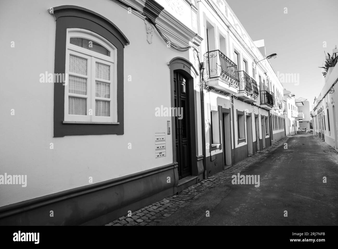 Cabanas de Tavira, Portugal- October 20, 2022: Traditional whitewashed facade and narrow street in Cabanas de Tavira town, Portugal Stock Photo