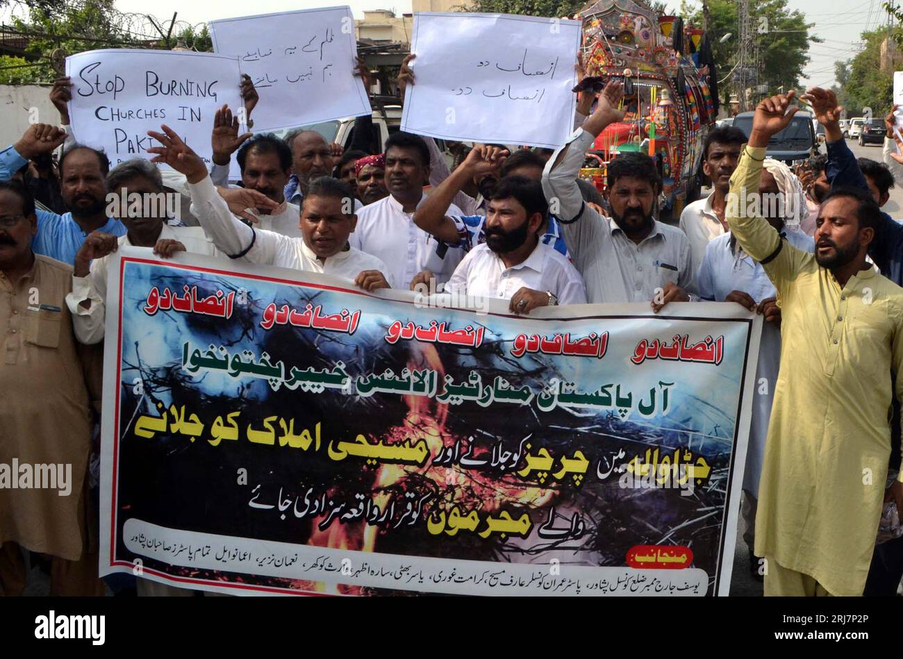 Members of Christian Community are holding protest demonstration against attack on churches in Jaranwala, at Peshawar press club on Monday, August 21, 2023. Stock Photo