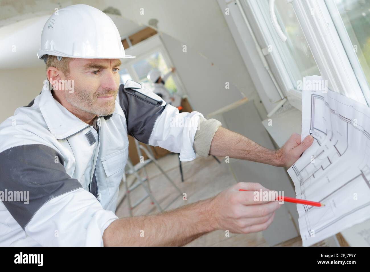 Checking Before Building Builder checking building plans hi-res stock photography and images - Alamy