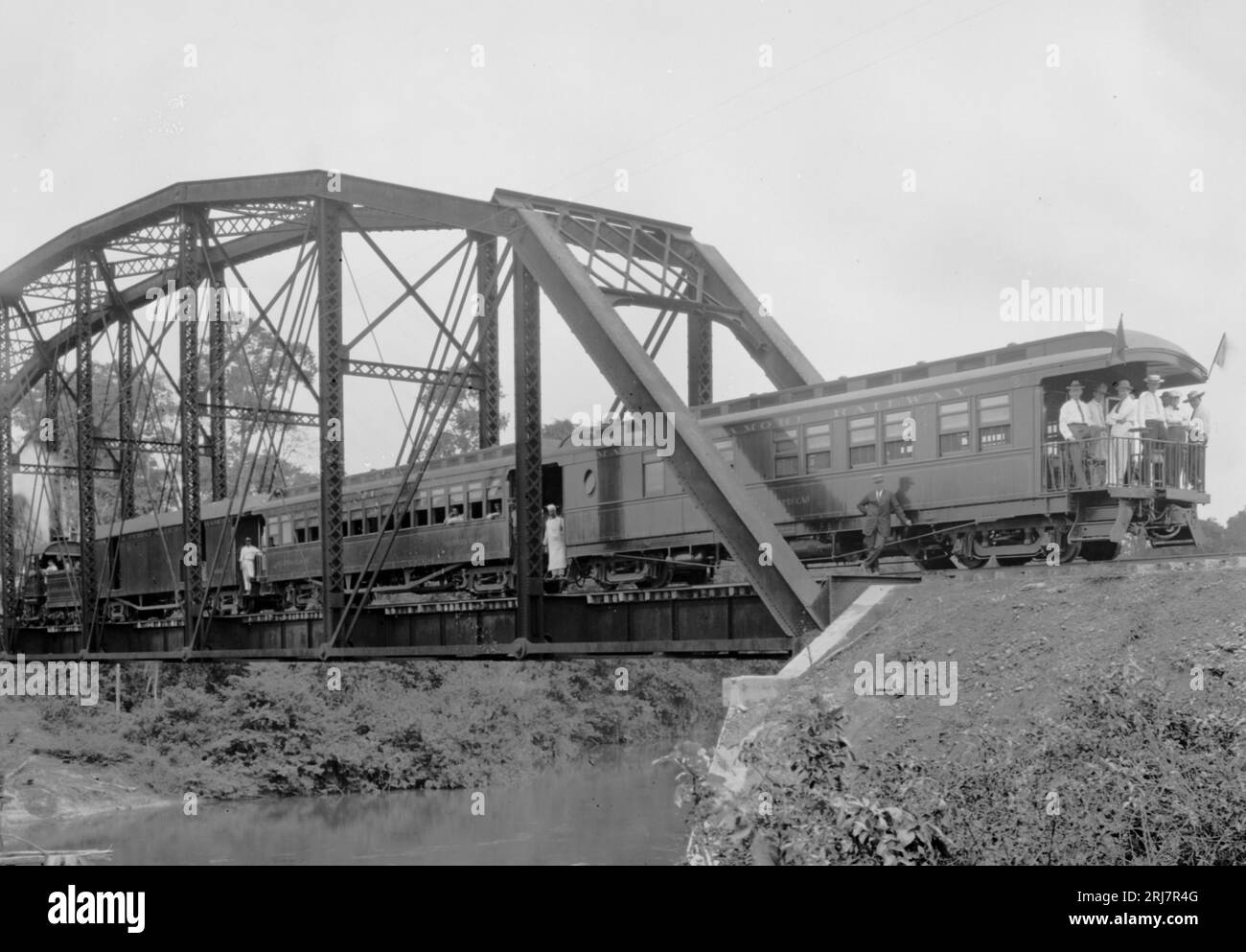 Trem com Passageiros e Autoridades em Ponte sobre Afluente do Rio Madeira, por Ocasião de Inauguração de Trecho da Ferrovia 1910 by Dana B. Merrill Stock Photo