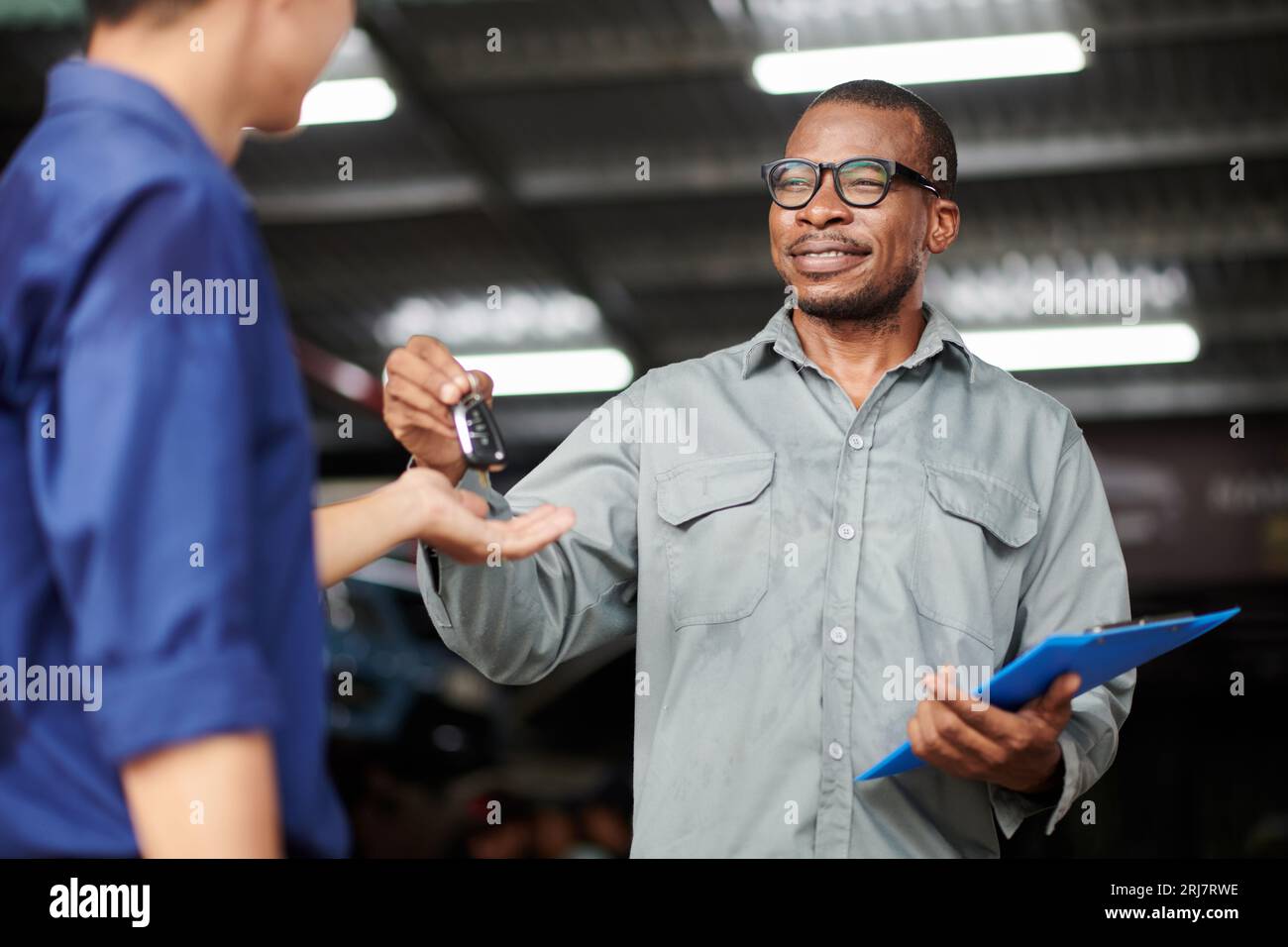 Cheerful mechanic hi-res stock photography and images - Alamy