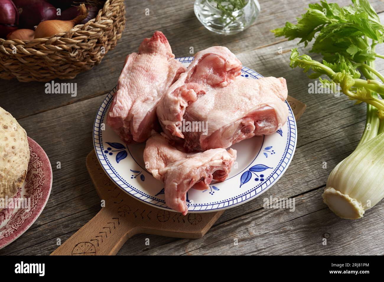 Ingredients for bone broth frozen chicken backs with fresh vegetables Stock Photo Alamy